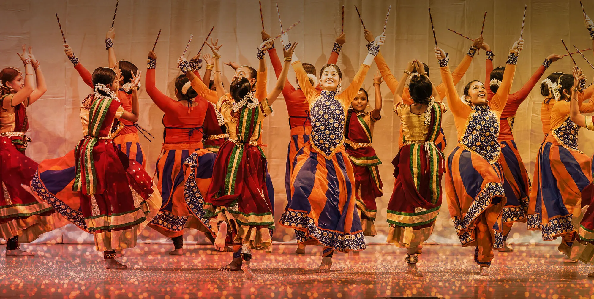 Shingari's School of Rhythm dancers performing in traditional Bollywood costumes